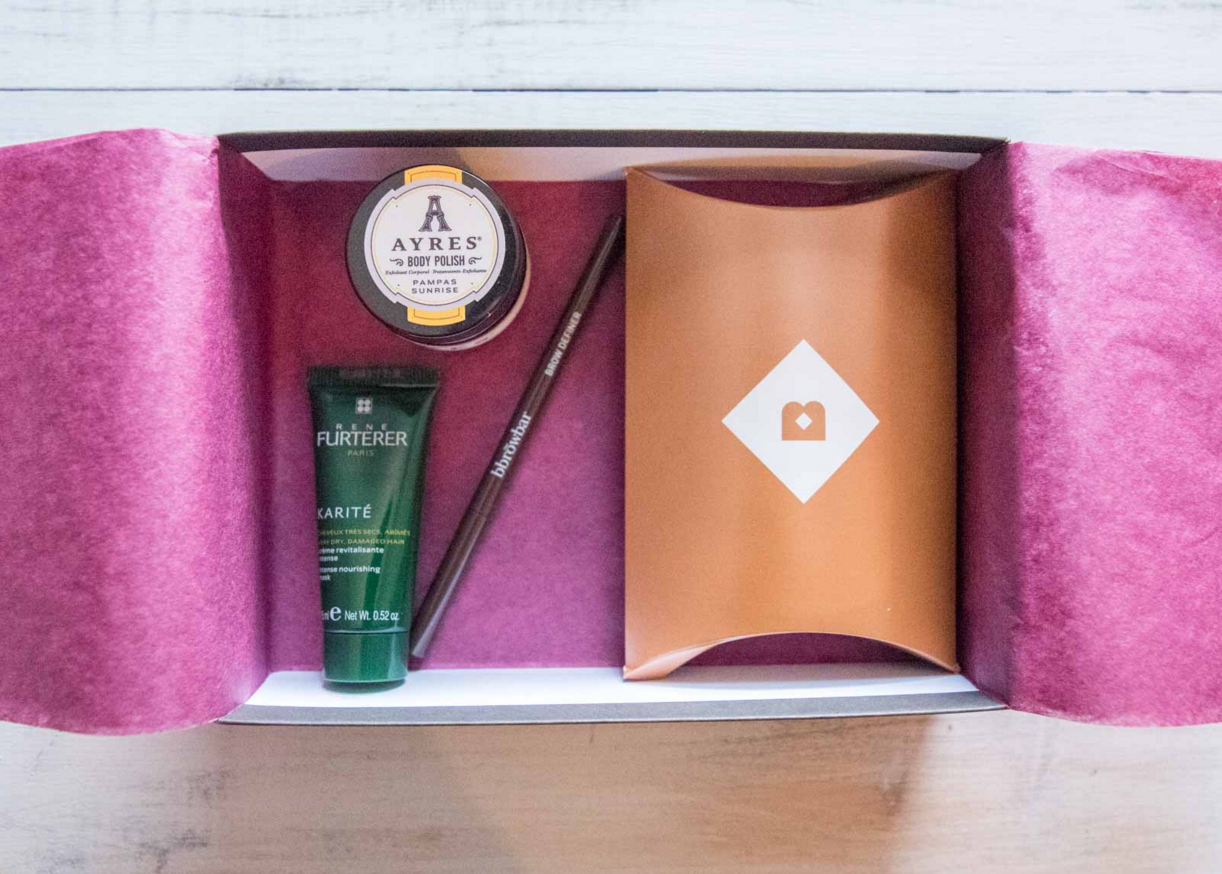 Inside of a Birchbox subscription package with purple wax paper