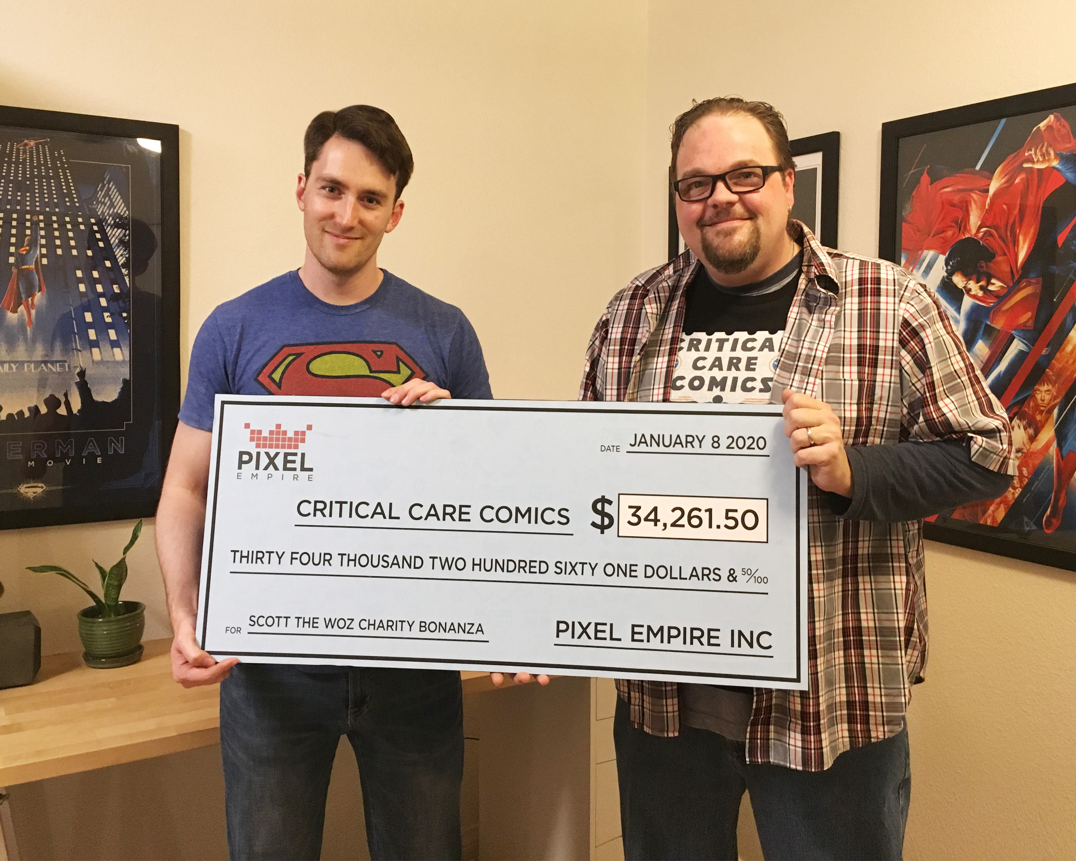Pixel Empire Dylan West and Scott the Woz Presenting Check to Critical Care Comics